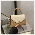 Beige and khaki crossbody bag with woven flap, top handle, and golden buckle detail - Khaki