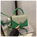 Green leather handbag with herringbone pattern flap and circular top handle for women - Green