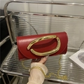 Chic red clutch bag with large gold buckle handle and chain strap for parties - Red