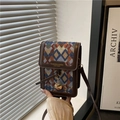 Retro-Umhängetasche aus gewebtem Material mit braunem Lederbesatz und Golddetails - Blau