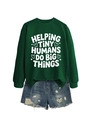 Flat lay of forest green sweatshirt with Helping Tiny Humans print and denim shorts - Dark Green (White Font)