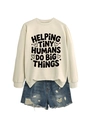 Flat lay of cream sweatshirt with black printed text and distressed denim shorts - Sand (Black Font)