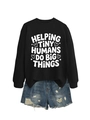 Detail of black crewneck sweatshirt with Helping Tiny Humans print and denim shorts - Black (White Font)