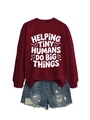 Flat lay of burgundy crewneck sweatshirt with Helping Tiny Humans print and denim shorts - Wine Red (White Font)