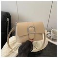 Detail of a minimalist cream shoulder bag with a large silver buckle and slim strap - Khaki