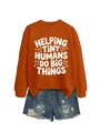 Detailed flat lay of burnt orange sweatshirt with slogan and distressed denim shorts - Burnt Orange (White Font)