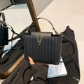 Classic black woven tote bag with golden V-shaped metal buckle and crossbody strap - Black