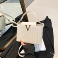 Elegant white square handbag with V-weave pattern and gold metal clasp closure - White