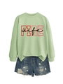 Detailed view of the FIRE wife letter print on a light green long sleeve sweatshirt - Olive Green (Black Text)