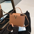 Elegant brown woven texture bucket bag with a stylish V-shaped metal buckle and strap - Brown