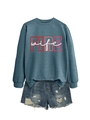 Detail of FIRE wife graphic on blue crewneck sweatshirt with distressed denim shorts - Blue (White Graphics)