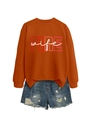 Detail of orange crewneck sweatshirt with FIRE wife print and distressed denim shorts - Burnt Orange (White Graphics)