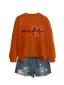 Detail of FIRE wife orange crewneck sweatshirt with distressed denim shorts set - Burnt Orange (Black Graphics)