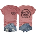 Flat lay of Girls Trip 2026 t-shirt with slogan back print and denim shorts - Rose Gold (Black Font)