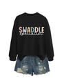 Flat lay detail of black graphic sweatshirt and distressed denim shorts with lettering - Black Sweatshirt (White Text)