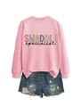 Detail of pink crewneck sweatshirt with SWADDLE specialist print and denim shorts - Pink Sweatshirt (Black Text)