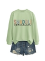 Flat lay of mint green crewneck sweatshirt featuring SWADDLE graphic print design - Olive Green Sweatshirt (Black Text)