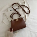 Brown lychee pattern crossbody handbag with golden swivel lock and adjustable strap - Brown