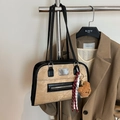 Khaki canvas tote bag with black leather trim and cute bear charm in a styled display - Khaki with Pendant