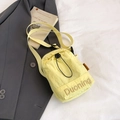Light yellow nylon crossbody bag with drawstring closure and adjustable shoulder strap - Yellow