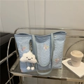 Light blue quilted butterfly tote bag with cloud plush keychain on a metal shelf - With Pendant / Blue