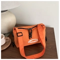 Close-up of orange crossbody bag featuring dual zippers and adjustable wide shoulder strap - Orange
