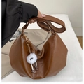 Brown half-moon shoulder bag with pebble texture and cute plush monster charm - Brown with Pendant