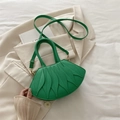 Bright emerald green pleated handbag with leaf texture and gold strap hardware - Green