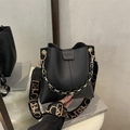 Black lychee leather bucket bag with patterned strap and fashion embossed detail - Black