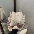 Cream white bucket bag with pebble leather texture and designer wide shoulder strap - White