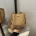 Litchi pattern leather bucket bag in camel brown with fashion chain and woven strap - Khaki