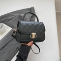Classic black quilted handbag with gold metal clasp and versatile shoulder strap - Black