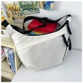 Detail of white nylon dumpling bag featuring multiple zip pockets and woven pullers - White