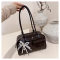 Detail of dark brown Boston bag with a large white lace bow and pearl heart charm - Coffee with Pendant