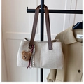 Detail of beige canvas tote with dark brown leather straps and cute bear pendant charm - Beige and Brown (with Charm)