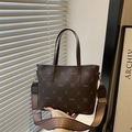 Dark brown tote bag with vintage monogram print and ethnic style woven shoulder strap - Brown