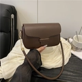 Retro dark brown leather crossbody handbag with gold hardware and elegant metal trim - Brown