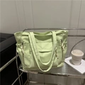Large mint green nylon tote bag with functional side pockets and adjustable shoulder straps - Green