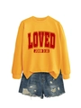 Detail view of yellow crewneck sweatshirt with vintage LOVED print and denim shorts - Yellow
