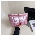 Close-up of bright pink quilted clutch bag with metallic finish and gold zipper detail - Pink