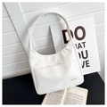 Detail of white minimalist faux leather tote bag with gold fashion typography - White