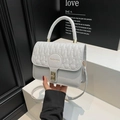Quilted light blue leather small square handbag with golden clasp and top handle - White
