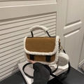 Brown suede crossbody bag with white shearling trim and round coin purse attachment - Tan