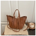 Detail showing deep brown faux leather tote with white contrast stitching and soft texture - Brown