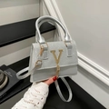 Silver-grey crossbody bag with golden V-metal detail and elegant fringe tassel - Silver