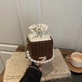 Brown woven leather bucket bag with white drawstring top and pearl beaded handle - Brown