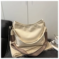 Creamy white hobo bag with dual straps featuring textured faux leather and gold hardware - White