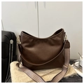 Dark brown faux leather tote bag with a geometric woven shoulder strap and gold hardware - Brown
