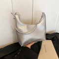 Minimalist silver metallic hobo bag with a textured pebble finish and crescent shape - Silver