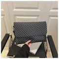 Dark grey envelope clutch bag with geometric patterns held to show portable large capacity - Black Monogram